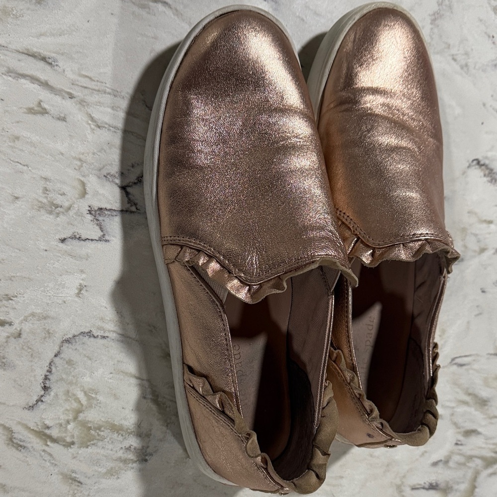 Kate Spade Metallic Lilly Ruffle Slip-On Sneakers in Rose Gold